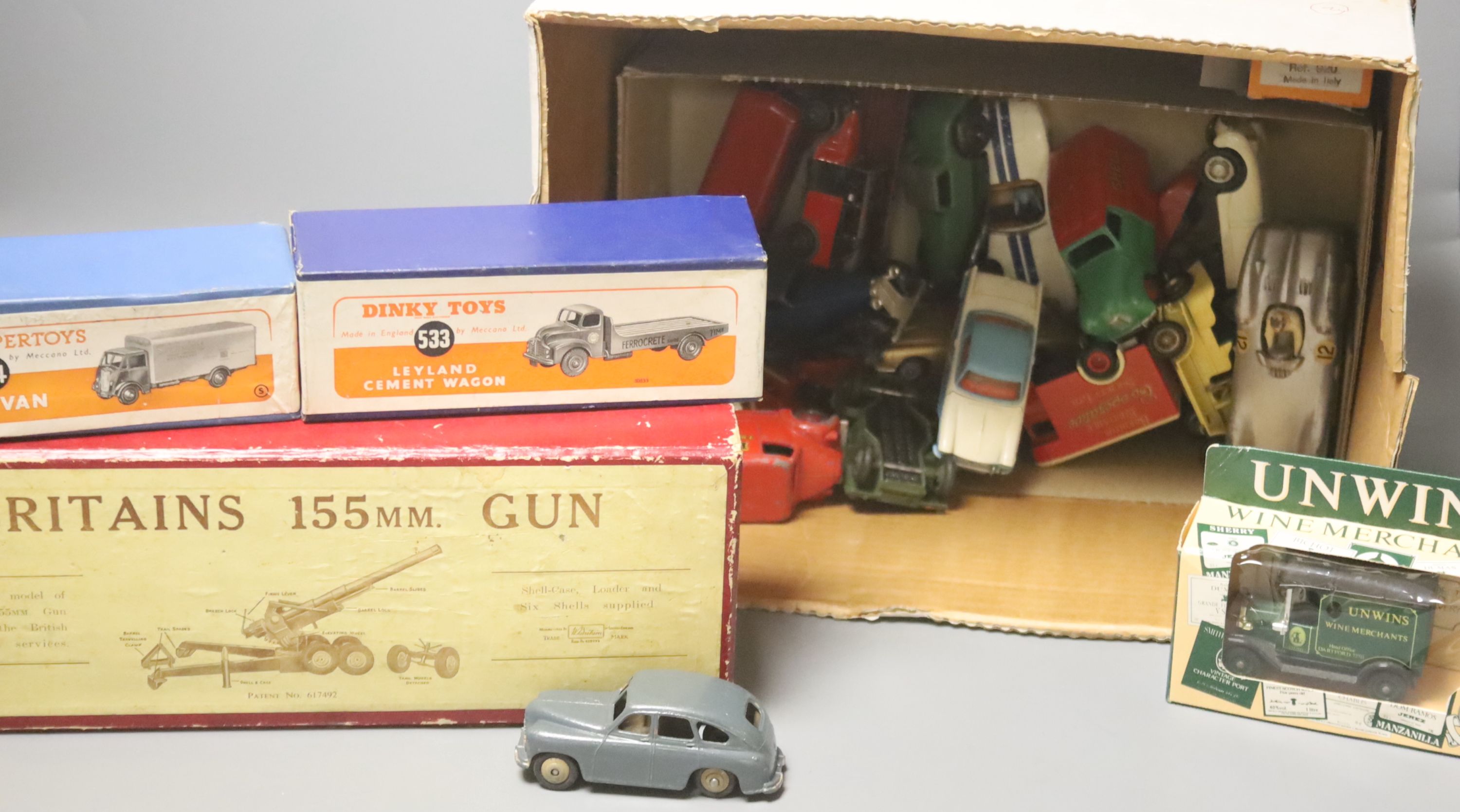 A boxed Britains 155MM gun, a Dinky Supertoys Guy Van 514 and Leyland Cement Wagon 533 and assorted diecast vehicles